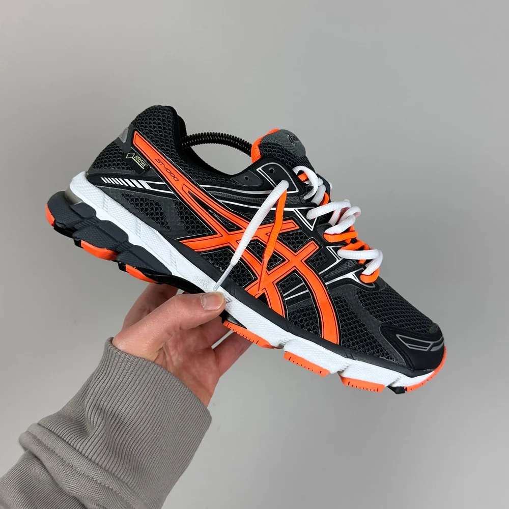 GEL Nimbus 16 — Anthracite / Orange vif